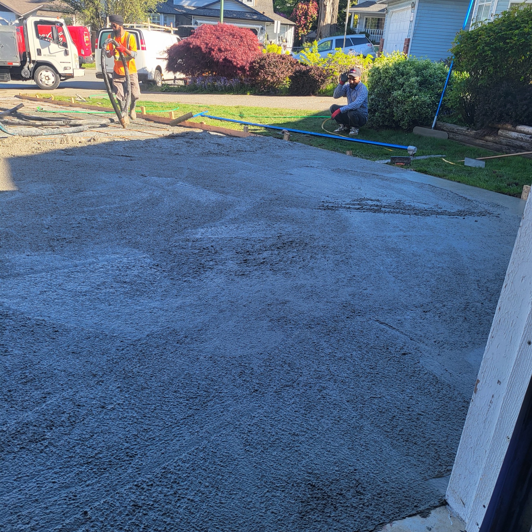 Concrete being placed and worked between the forms