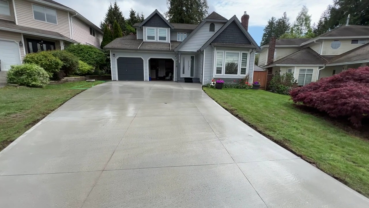 Finished driveway running past a house to the street